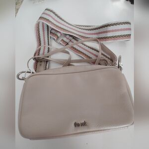 The Sak Cora Crossbody Bag in Blush Pink with Striped Strap